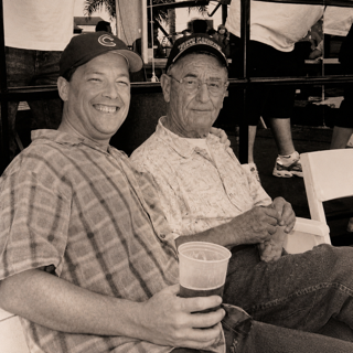A family photograph of Dr. David Lowe sitting beside his father, Dr. W.J. Lowe